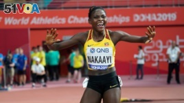 FILE - Halimah Nakaayi, of Uganda, celebrates as she wins the gold medal in the women's 800 meter final at the World Athletics Championships in Doha, Qatar, Sept. 30, 2019.