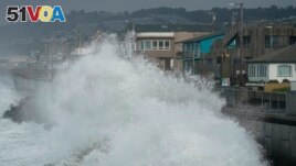 FILE - Large waves crash into a seawall in Pacifica, Calif., on Jan. 6, 2023. New data permits researchers to follow the growth of big waves over 90 years. (AP Photo/Jeff Chiu, File)