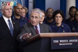 Dr. Anthony Fauci, director of the National Institute of Allergy and Infectious Diseases, with Vice President Mike Pence behind him, speaks during a briefing about the coronavirus in the James Brady Press Briefing Room of the White House, March 15, 2020,