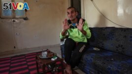 Unemployed Lebanese Hussein Hamadeh speaks during an interview with Reuters inside his home in Beirut's southern area of Ouzai, Lebanon on November 15, 2022. (REUTERS/Mohamed Azakir)
