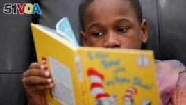 Michael Crowder, 11, reads during an after-school literacy program in Atlanta on Thursday, April 6, 2023. (AP Photo/Alex Slitz)