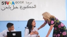 FILE - First Lady Jill Biden interacts with a student at Ibn Al Arif high school during her visit to Marrakech, Morocco, Monday, June 5, 2023. (AP Photo/Mosa'ab Elshamy, Pool, File)