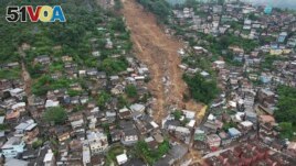 An aerial view shows a neighborhood affected by landslides in Petropolis, Brazil, Wednesday, Feb. 16, 2022. 