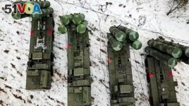 In this photo taken from video provided by the Russian Defense Ministry Press Service on Thursday, Feb. 10, 2022,cCombat crews of the S-400 air defense system take up combat duty at the training ground in the Brest region during the Union Courage-2022 Rus