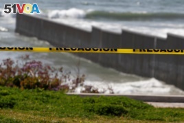 A police tape is seen near the beach and the Mexico-U.S. border fence, after municipal beaches are closed as part of social distancing measures to control the spread of the coronavirus in Tijuana, Mexico March 30, 2020.
