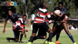 Members of the Zimbiru Rugby Academy Club, an all-female rugby team, play a match in the capital Harare, in Zimbabwe, April 29, 2023. (REUTERS/Philimon Bulawayo)