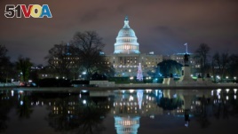 The U.S. Capitol is seen at night after negotiators sealed a deal for COVID relief, Dec. 20, 2020, in Washington.