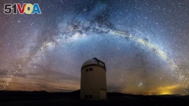  The warped shape of the stellar disk of the Milky Way is seen over the Warsaw University Telescope at Las Campanas Observatory, Chile, in an artist's rendition, Aug. 1, 2019. (Jan Skowron/University of Warsaw)