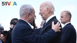 Israel Prime Minister Benjamin Netanyahu (L) greets US President Joe Biden upon his arrival at Tel Aviv's Ben Gurion airport on October 18, 2023, amid the ongoing battles between Israel and the Palestinian group Hamas. (Photo by Brendan SMIALOWSKI / AFP)