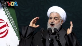 Iranian President Hassan Rouhani speaks during a ceremony celebrating the 41st anniversary of the Islamic Revolution, at Azadi (Freedom) Square in Tehran, Iran, Feb. 11, 2020.