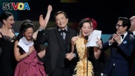 Jenny Slate, from left, Stephanie Hsu, James Hong, Michelle Yeoh, and Ke Huy Quan accept the award for outstanding performance by a cast in a motion picture. (AP Photo/Chris Pizzello)