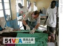Sam Jones from Doctors Without Borders treats a patient in southern Sudan