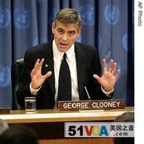 Actor George Clooney speaks to reporters at the United Nations headquarters in New York 