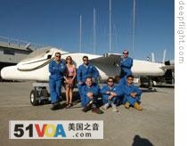 Graham Hawkes and his team beside the Deep Flight Challenger