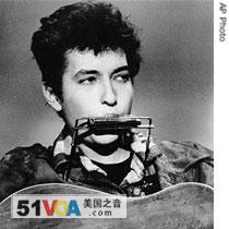 Bob Dylan plays the harmonica and acoustic guitar in March 1963
