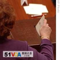 An elector in the state of New York casts her vote in the 2004 presidential election