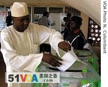 A voter casts his ballot at a polling station in Abuja, Nigeria