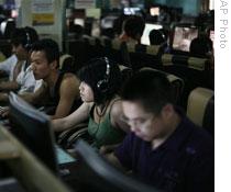 Young people at an Internet cafe in Beijing. China has nearly 300 million Internet users.