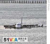 Passengers and crew wait to be rescued