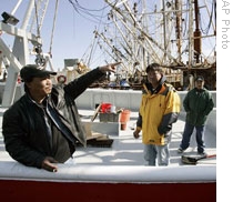 Lam Huynh, left, with crew members of his fishing boat, the Mekong, in Cape May
