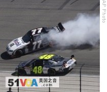 Sam Hornish Junior (77) slides in front of Jimmie Johnson (48) during the NASCAR Samsung 500 race at Texas Motor Speedway in Fort Worth on April 5