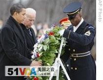 Barack Obama and Joe Biden laid flowers at the Tomb of the Unknowns at Arlington National Cemetery in Virginia on Sunday