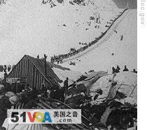 A long line of gold seekers heads up the Chilkoot Pass