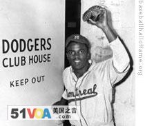 Jackie Robinson entering the Dodgers' clubhouse for the first time