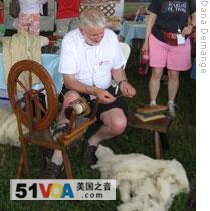 A man from Wales making wool thread