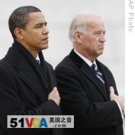 President-elect Barack Obama and Vice President-elect Joe Biden during the playing of Taps as they lay a wreath at the Tomb of the Unknowns at Arlington National Cemetery, 18 Jan 2009<br />