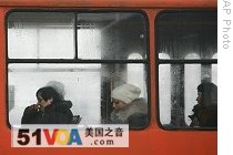 People ride in a unheated tram in effort to save on electric power in Bulgarian capital, Sofia, 8 Jan. 2009 