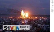 Fire and smoke are seen from Israeli military bombardment in Gaza City, 08 Jan 2009