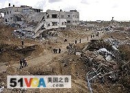 Palestinians inspect the rubble of a building in the eastern area of Jebaliya after Israeli troops withdrew in the northern Gaza Strip, Sunday, 18 Jan. 2009