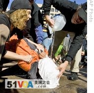 Protesters simulate the use of waterboarding in front of the Justice Department in Washington, (file photo)
