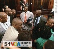 Senior members of the African National Congress react after South Africa's Supreme Court of Appeals overturned a lower court decision to throw out the case against ANC leader and presidential hopeful Jacob Zuma, 12 Jan 2009.