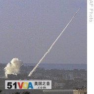 Rocket fired by Palestinians militants in Gaza Strip flies towards Israeli target as seen from  Israel-Gaza border in southern Israel, 30 Dec 2008