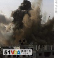 An explosion is seen where the Israeli military is bombing an area around alleged smuggling tunnels in Rafah, southern Gaza Strip, 14 Jan 2009