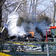 Inivestigator arrives at scene of plane crash in Clarence Center, New York, just north and east of Buffalo, 13 Feb 2009