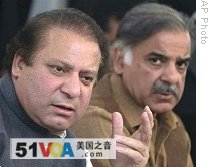 Nawaz Sharif, left, speaks as his brother Shahbaz Sharif looks on in Lahore (File photo)