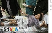A Palestinian girl who was injured in an Israeli missile strike reacts in hospital in Khan Younis, southern Gaza Strip, Thursday, 29 Jan. 2009