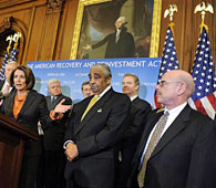 House Speaker Nancy Pelosi, fourth from left, speaks at a news conference on Capitol Hill, 13 Feb 2009, after the House passed the stimulus legislation
