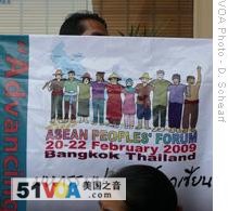 An activist holds a poster at ASEAN Summit in Hua Hin, Thailand, 28 Feb 2009
