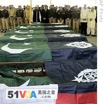 Pakistani police attend the funerals of police killed on Monday's attack in Lahore, Pakistan, 31 Mar 2009