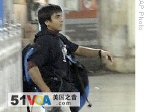 This Nov. 26, 2008, file photo shows gunman Mohammed Ajmal Kasab walking at Chatrapathi Sivaji Terminal railway station in Mumbai, India