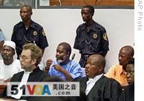 In 2nd row, Revolutionary United Front (RUF) defendants accused of war crimes in the 1991-2002 conflict in Sierra Leone appear at opening trials of Special Court for Sierra Leone in Freetown, (2004 file photo)