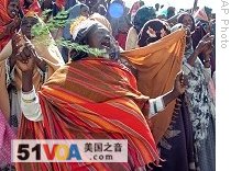 Somali women celebrate the implementation of Islamic law at Konis stadium, in Mogadishu, 19 April 2009
