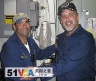 U.S. Navy photo shows Maersk-Alabama Capt. Richard Phillips, right, standing alongside Cmdr. Frank Castellano, commanding officer of the USS Bainbridge, after being rescued by U.S. forces off the coast of Somalia