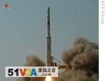 A 07 Apr 2009 video grab by N. Korean TV shows  a three-stage white rocket, being launched  from an undisclosed location in N. Korea
