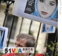 Members of media watchdog Reporters Without Borders demonstrate at the Iranian Embassy in Paris to call for the liberation of three journalists including reporter Roxana Saberi, 03 May 2009