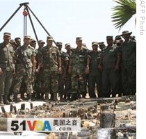 The picture released by the Sri Lankan Defence Ministry, 16 May 2009, allegedly shows government troops inspecting heavy weapons captured from Tamil Tiger rebels in northeastern Mullaittivu district